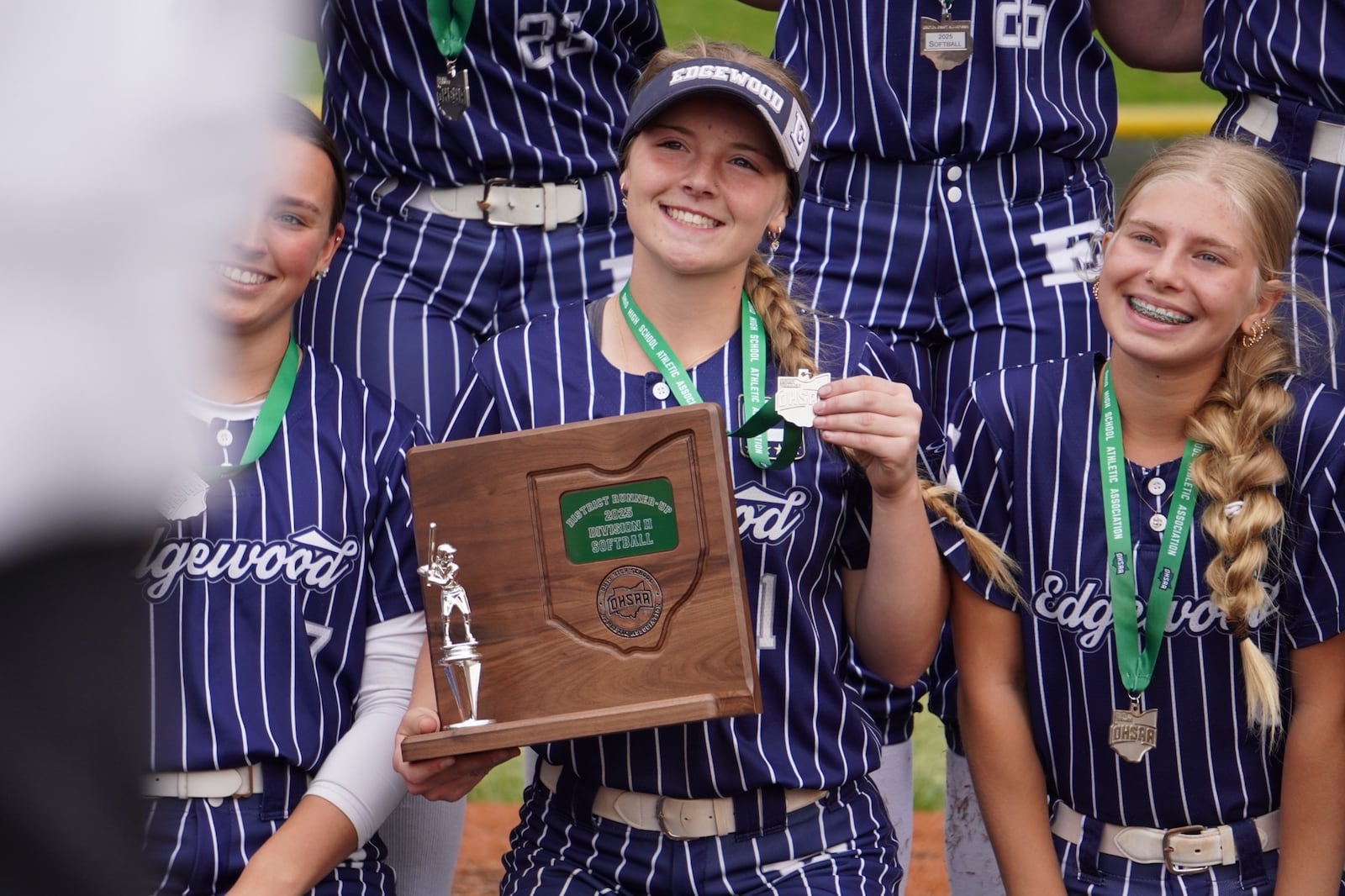 Edgewood senior Evelyn Henson holds the Division II district runner-up trophy. CHRIS VOGT / CONTRIBUTED