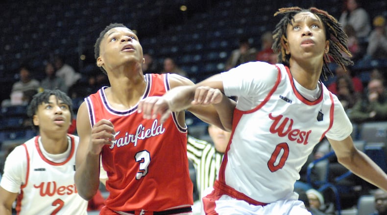Fairfield's Kam Sanders (3) and Lakota West's Bryce Curry (0) go after a rebound during their game on Thursday night at Xavier University's Cintas Center. Chris Vogt/CONTRIBUTED