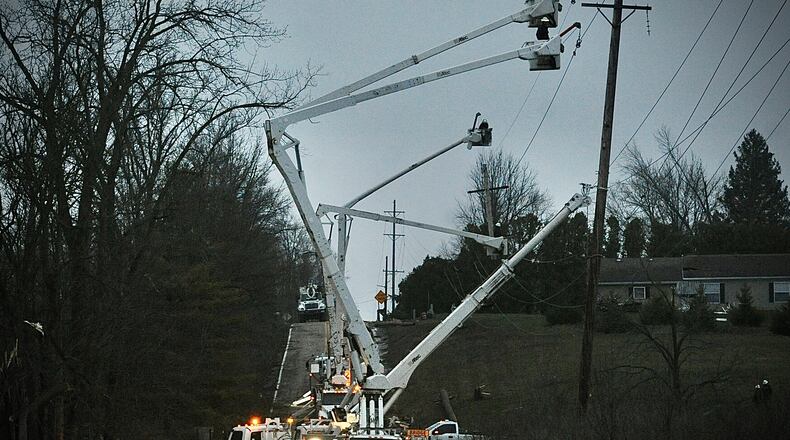 Power crews work on restoring power along Rangeline Road near Bradford early Friday morning March 15, 2024. MARSHALL GORBY \STAFF