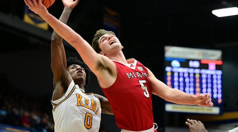 Miami (OH) RedHawks guard Peter Suder goes to the basket against Kent State forward Rayvon Griffith during the first half of an NCAA college basketball game, Tuesday, Jan. 20, 2026, in Kent, Ohio. (AP Photo/David Dermer)