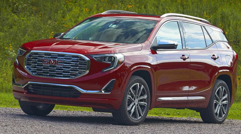 The all-new 2018 GMC Terrain provides great value in packaging with a host of standard premium features, including a new 170-hp, 1.5L turbo engine paired with a new nine-speed automatic transmission; driver-controllable Traction Select system; signature LED daytime running lamps and taillamps; leather-wrapped steering wheel; flat-folding front passenger seat; and keyless open and start. The Terrain Denali raises the bar even further to add a standard 252-hp, 2.0L turbo engine; 19-inch ultra-bright machined aluminum wheels; LED headlamps; heated leather-wrapped steering wheel; hands-free power programmable liftgate; an 8-inch diagonal infotainment system with navigation; Bose premium seven-speaker audio system; and a suite of standard safety features. GMC photo