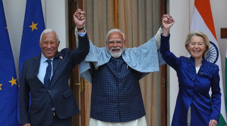 Indian Prime Minister Narendra Modi, center, welcomes European Council President Antonio Costa, left and European Commission President Ursula von der Leyen before their meeting in New Delhi, India, Tuesday, Jan. 27,2026. (AP Photo/Manish Swarup)
