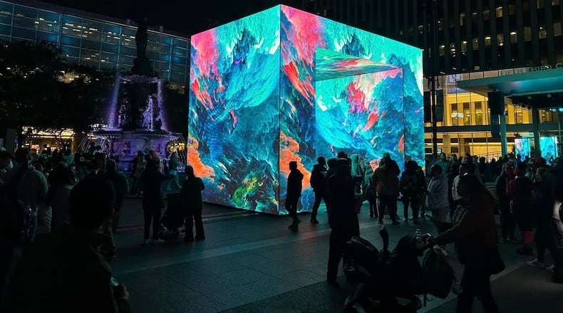 Spectators check out one of the main visuals that is part of the BLINK festival in Cincinnati and Northern Kentucky. This photo was taken Thursday, Oct. 17, 2024. WCPO/CONTRIBUTED