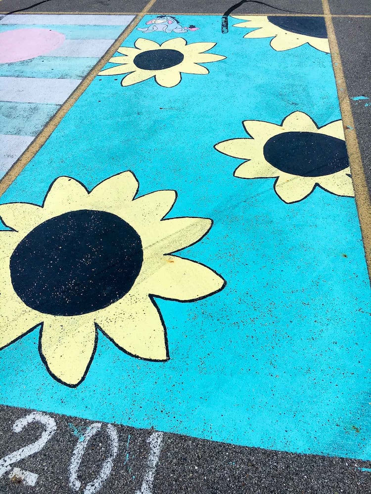 PHOTOS Lakota East seniors paint parking spots