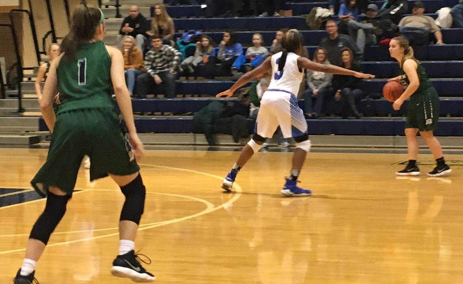 Badin’s Macy Harper dribbles the ball under the watchful eye of Hamilton’s Anna Cardwell (3) during Monday night’s game at the Hamilton Athletic Center. No. 1 is Badin’s Claire MacGowan. RICK CASSANO/STAFF