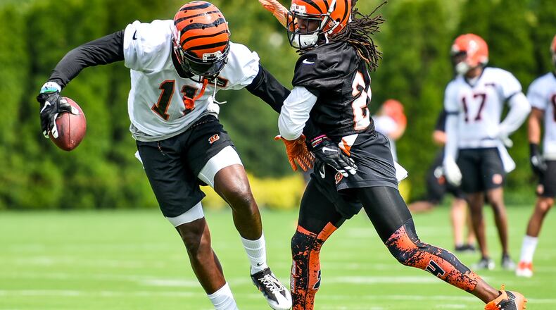 Wide receiver Brandon LaFell makes a catch defended by cornerback Adam Jones during the first day of Cincinnati Bengals Training Camp Friday, July 28 at the practice fields beside Paul Brown Stadium in Cincinnati. NICK GRAHAM/STAFF