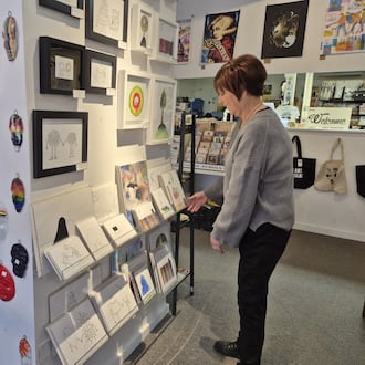 DJ Gallvin, co-owner of Urban Handmade in Yellow Springs, said the town sees a lot of people who have returned to Ohio for the holidays during Small Business Saturday. MICHAEL KURTZ / STAFF