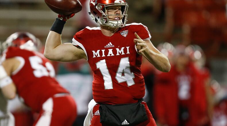 Gus Ragland #14 of the Miami Ohio Redhawks throws a pass against the Akron Zips during the second half at Yager Stadium on November 7, 2017 in Oxford. Ragland rushed for three touchdowns and passed for 313 yards in the RedHawks’ 51-42 loss to Buffalo on Tuesday night. (Photo by Michael Reaves/Getty Images)