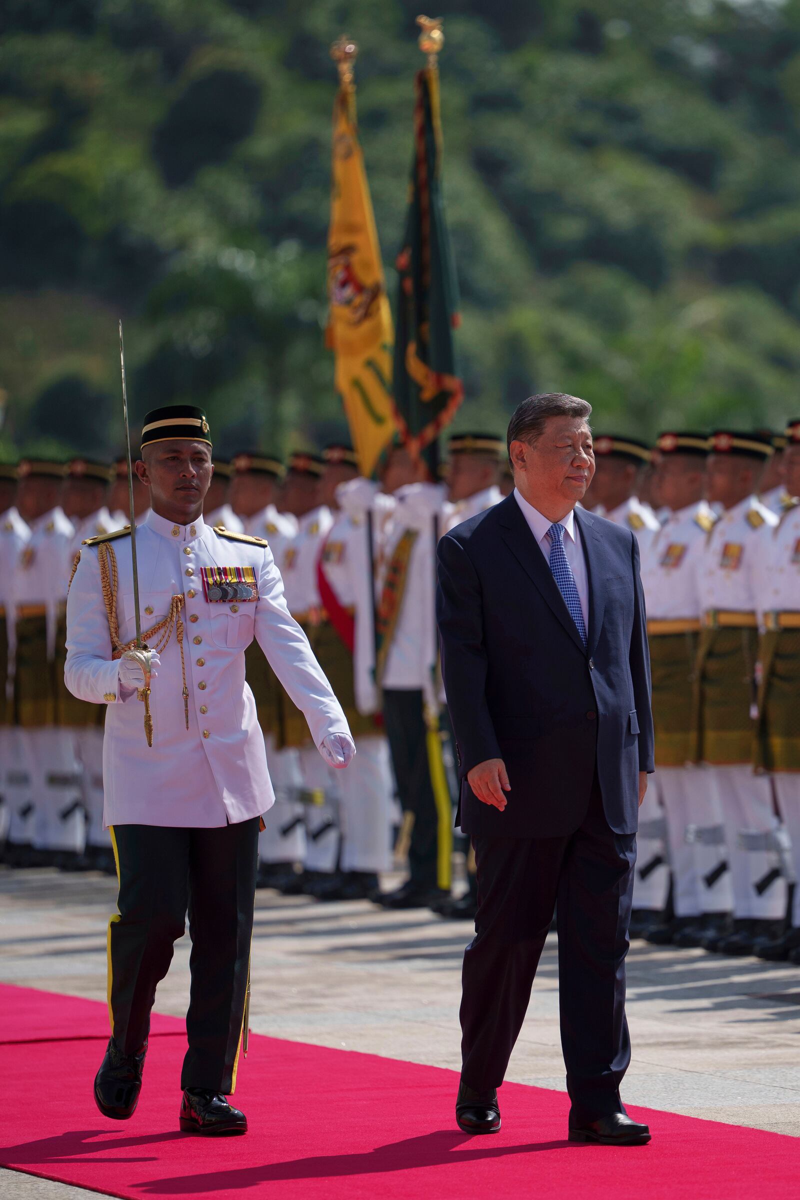 Chinese President Xi Jinping inspects honor guards during the official welcoming ceremony at the national palace in Kuala Lumpur, Malaysia, Wednesday, April 16, 2025. (AP Photo/Vincent Thian, Pool)