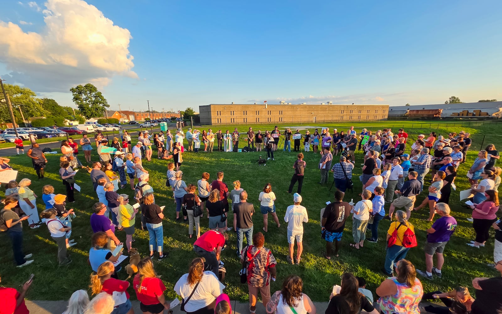 Over 100 faith leaders and advocates hold a candlelight vigil for Alonzo Tomas Mendez and other immigrants being held in Butler County Jail Tuesday, July 1, 2025 just outside the fence of the Butler County Sheriff's Office in Hamilton. NICK GRAHAM/STAFF