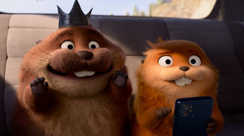 This image released by Disney shows Mabel Beaver, voiced by Piper Curda, right, and King George, voiced by Bobby Moynihan in a scene from the animated film "Hoppers." (Disney/Pixar via AP)