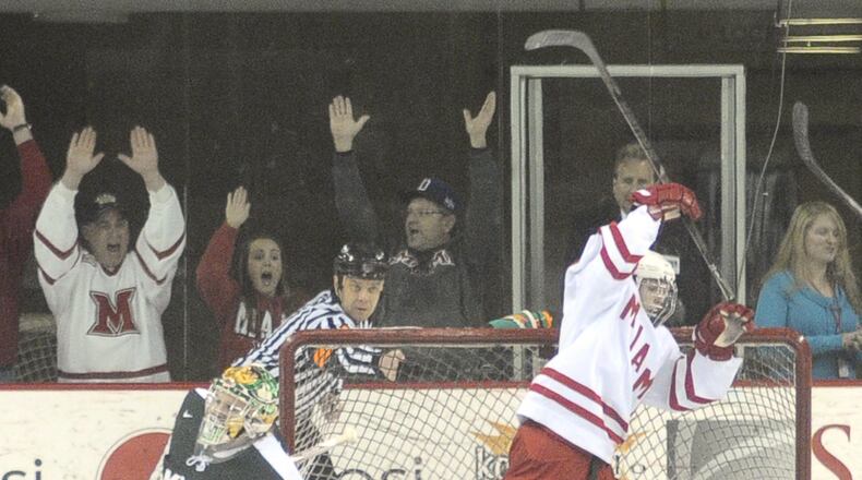 Miami Redhawk's Austin Czarnik reacts after scoring the second goal of the first period against Michigan State Goalie Jake Hildebrand during the first period of their CCHA Quarterfinals game 2 Saturday night Mar. 16, 2013 at Steve Cady Arena in Oxford. (CONTRIBUTED BY MARTIN WHEELER III)