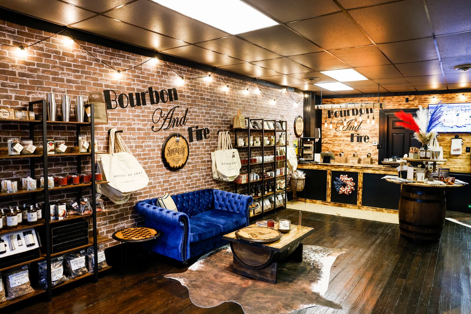 Bourbon and Fire will open their new storefront Wednesday, June 28 on Main Street in Hamilton. The store features custom laser engraved bourbon barrel lid games and decor, mixers, cigars and more. The back of the shop has a curated clothing boutique. NICK GRAHAM/STAFF
