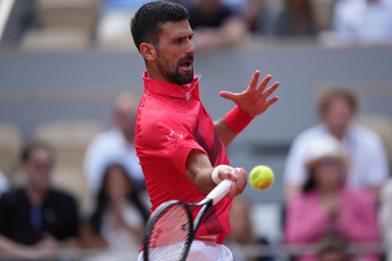 Serbia's Novak Djokovic plays a shot against Britain's Cameron Norrie during their fourth round match of the French Tennis Open at the Roland-Garros stadium in Paris, Monday, June 2, 2025. (AP Photo/Thibault Camus)