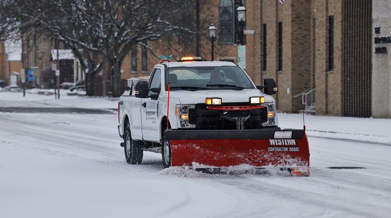FILE: City crews work to clear snow on the streets of Middletown, Jan. 17, 2022. NICK GRAHAM/STAFF