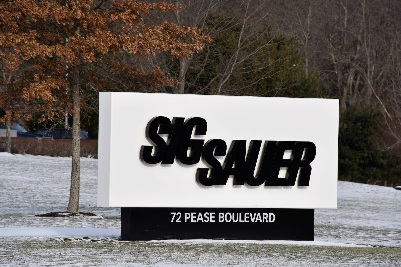This Jan. 14, 2016, file photo shows the sign at the entrance to the headquarters of Sig Sauer, a gun manufacturer based in Newington, N.H. (AP Photo/Lisa Marie Pane, file)