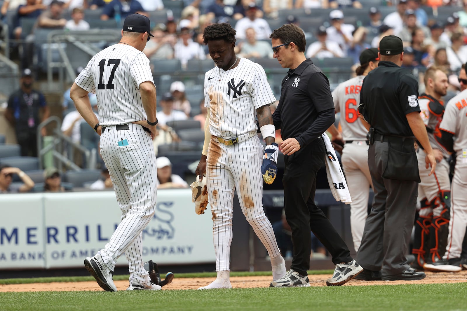 New York Yankees' Jazz Chisholm Jr. walks off the field after colliding with Baltimore Orioles catcher Maverick Handley while scoring during the second inning of a baseball game Sunday, June 22, 2025, in New York. (AP Photo/Pamela Smith)