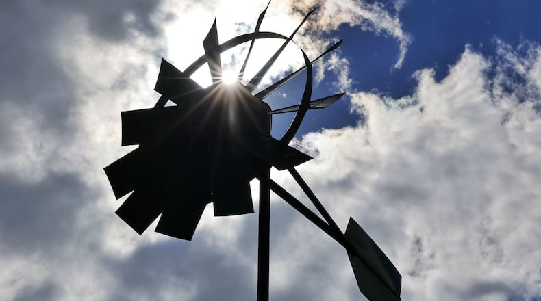 Fairfield has developed a comprehensive sustainability plan called Fairfield Sustains. Over the years, the city has incorporated elements of sustainability around the city, including the electric vehicle charging station at the Community Arts Center on Wessell Drive, a pair of projects at Huffman Park, 2100 Gray Road, which include a wind turbine, pictured, used to power pond aeration system and the park's community garden. Fairfield City Council is expected to adopt the plan at its next meeting in September. NICK GRAHAM/FILE
