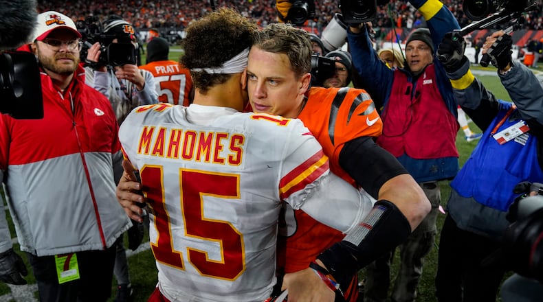 Cincinnati Bengals quarterback Joe Burrow (9) meets with Kansas City Chiefs quarterback Patrick Mahomes (15) following an NFL football game in Cincinnat, Sunday, Dec. 4, 2022. The Bengals defeated the Chief 27-24. (AP Photo/Jeff Dean)