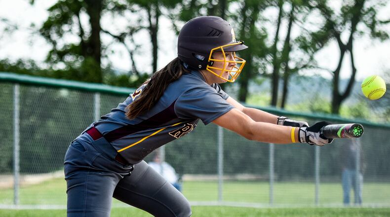Emily Poling of Ross bunts the ball during a softball game against Badin on April 27, 2017, at Joyce Park in Hamilton. Badin won 6-2. NICK GRAHAM/STAFF
