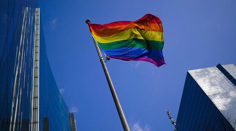A rainbow flag flutters in the wind. (AP Photo/Francisco Seco)