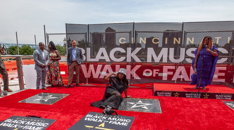 Penny Ford, an American singer-songwriter, multi-instrumentalist and record producer from Cincinnati, poses next to her star at the Cincinnati Black Music Walk of Fame in July 2022. CONTRIBUTED/CINCYBLACKMUSICWALKOFFAME.ORG