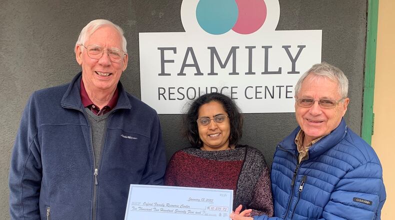 Kiwanis Vice President John Skillings and Kiwanis Community Services Chair Dave Belka present an initial check for $11,422 to Nicola Rodrigues, Interim Director and Client Services for the Family Resource Center. CONTRIBUTED