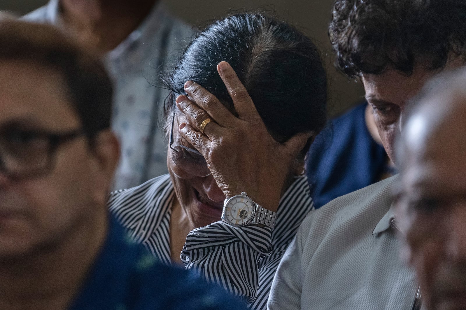 Mother of Clive Kunder, co-pilot of the Air India flight that crashed in Ahmedabad last month, mourns during a prayer meeting for the Air India crew, at a church in Mumbai, India, Saturday, July 12, 2025. (AP Photo/ Rafiq Maqbool)