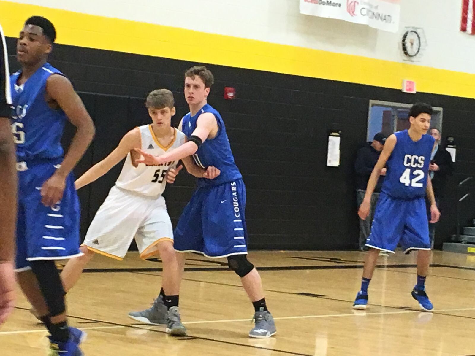 Cincinnati Christian’s Sam Wells (11) stays close to Georgetown’s Alex Bolington (55) during Saturday night’s Division IV sectional final at Taylor. RICK CASSANO/STAFF
