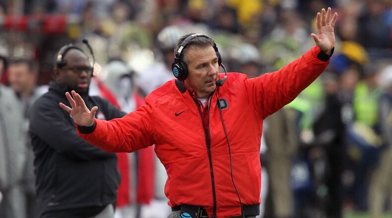 Ohio State’s Urban Meyer talks to his players during a game against Michigan on Saturday, Nov. 25, 2017, at Michigan Stadium in Ann Arbor, Mich. David Jablonski/Staff