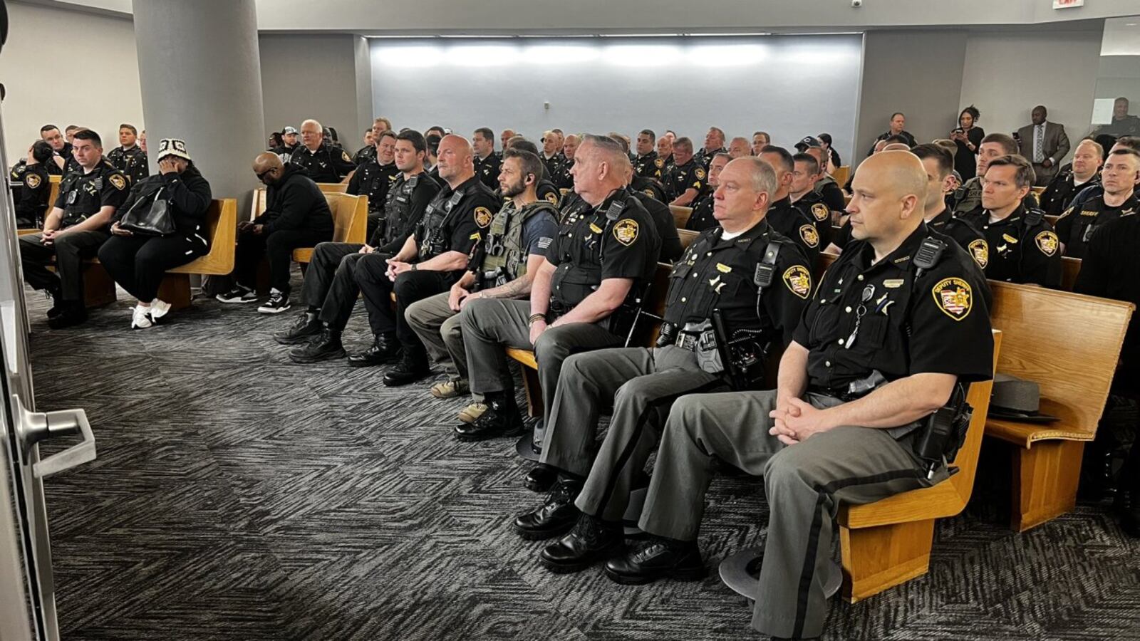 Officers and friends and family attend Rodney Hinton Jr.'s bond hearing. WCPO/CONTRIBUTED