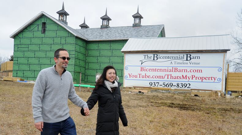 Chris Koehler and Jing Wang are planning to open an event space at The Bicentennial Barn on Bellfontaine Road in Huber Heights. MARSHALL GORBY\STAFF