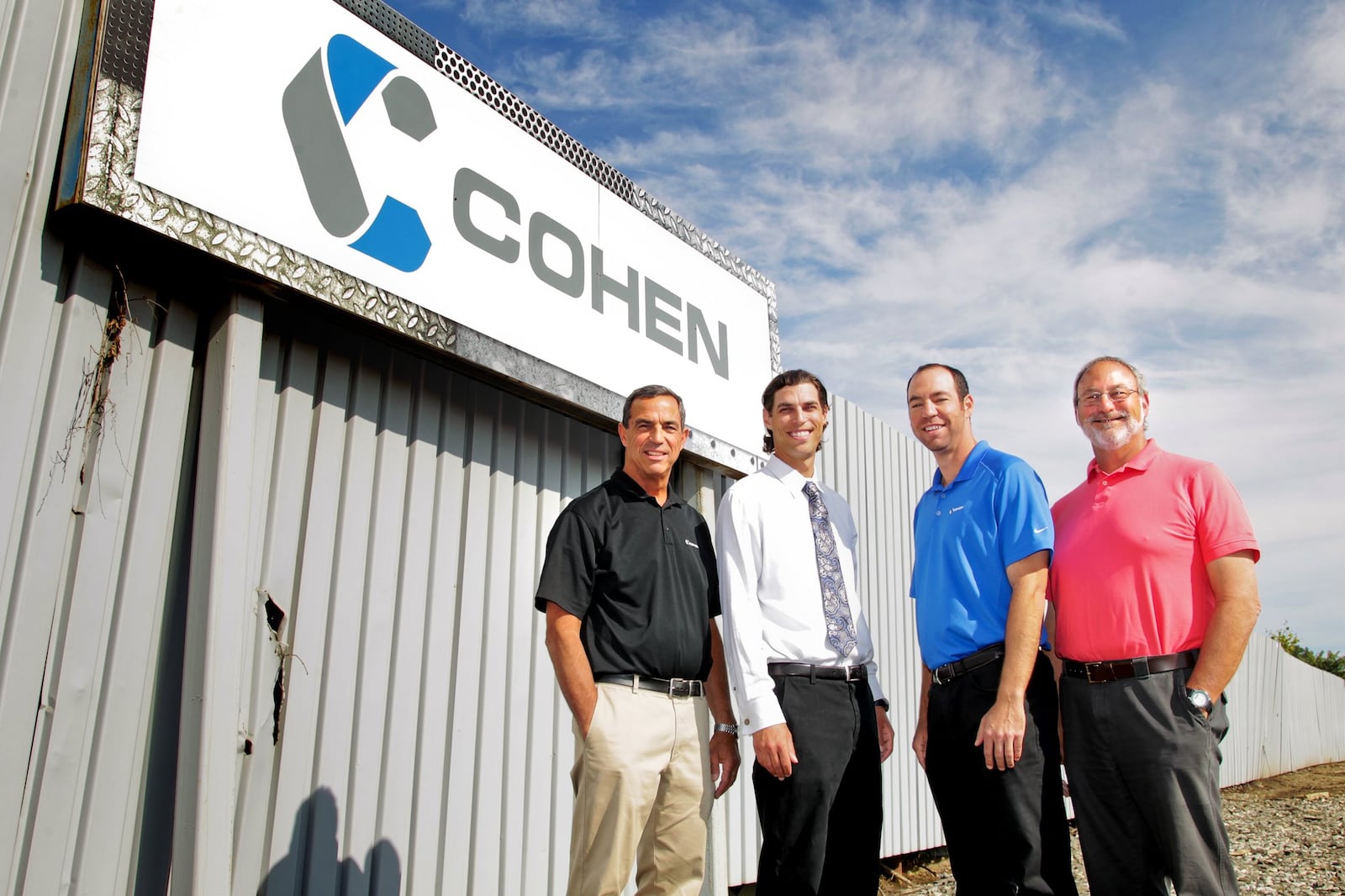 From left, Ken Cohen, Andy Cohen, Adam Dumes and Neil Cohen stand outside Cohen Recycling in Middletown Thursday, Aug. 15, 2013. NICK DAGGY / STAFF
