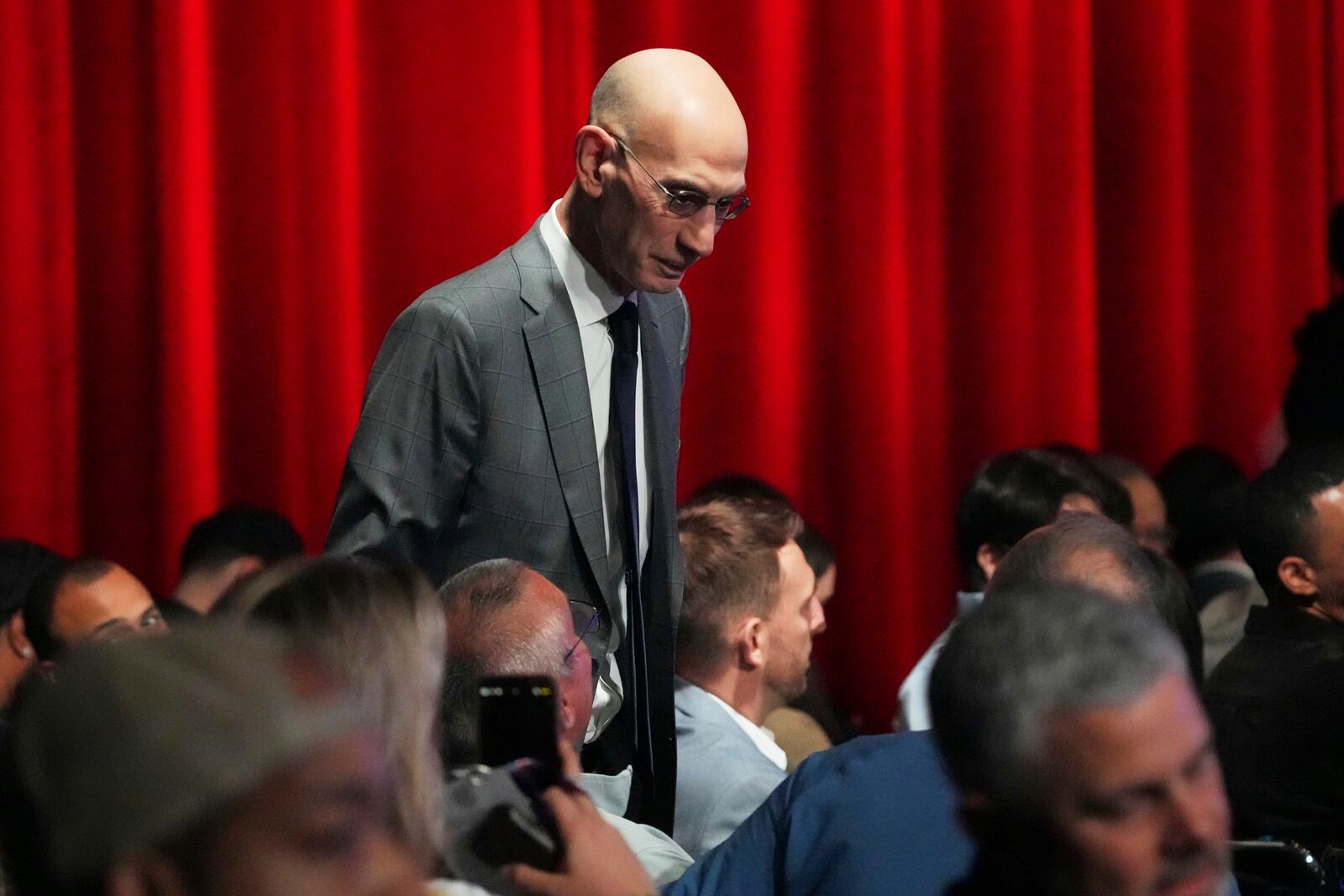 NBA commissioner Adam Silver walks through the audience in the NBA basketball draft lottery in Chicago, Monday, May 12, 2025. (AP Photo/Nam Y. Huh)