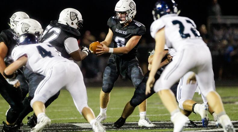Lakota East quarterback TJ Kathman prepares to hand off the ball during their game against Kettering Fairmont Friday, Sept. 6 at Lakota East High School in Liberty Township. Lakota East won 14-6. NICK GRAHAM/STAFF