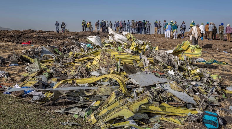 FILE - Wreckage is piled at the crash scene of Ethiopian Airlines flight ET302 near Bishoftu, Ethiopia, March 11, 2019. (AP Photo/Mulugeta Ayene, File)