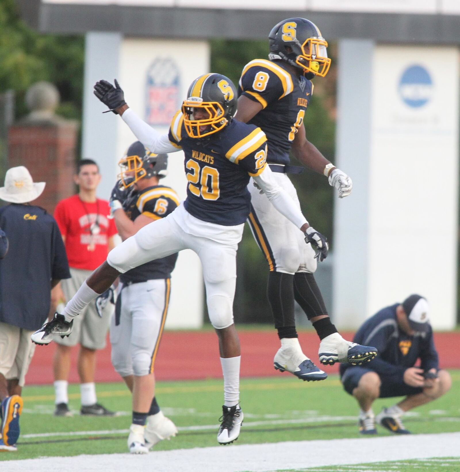 Springfield’s Quincy Scott, left, and Shane Ramey celebrate a victory against Dublin Coffman on Saturday, Aug. 27, 2016, at Edwards-Maurer Field in Springfield. David Jablonski/Staff