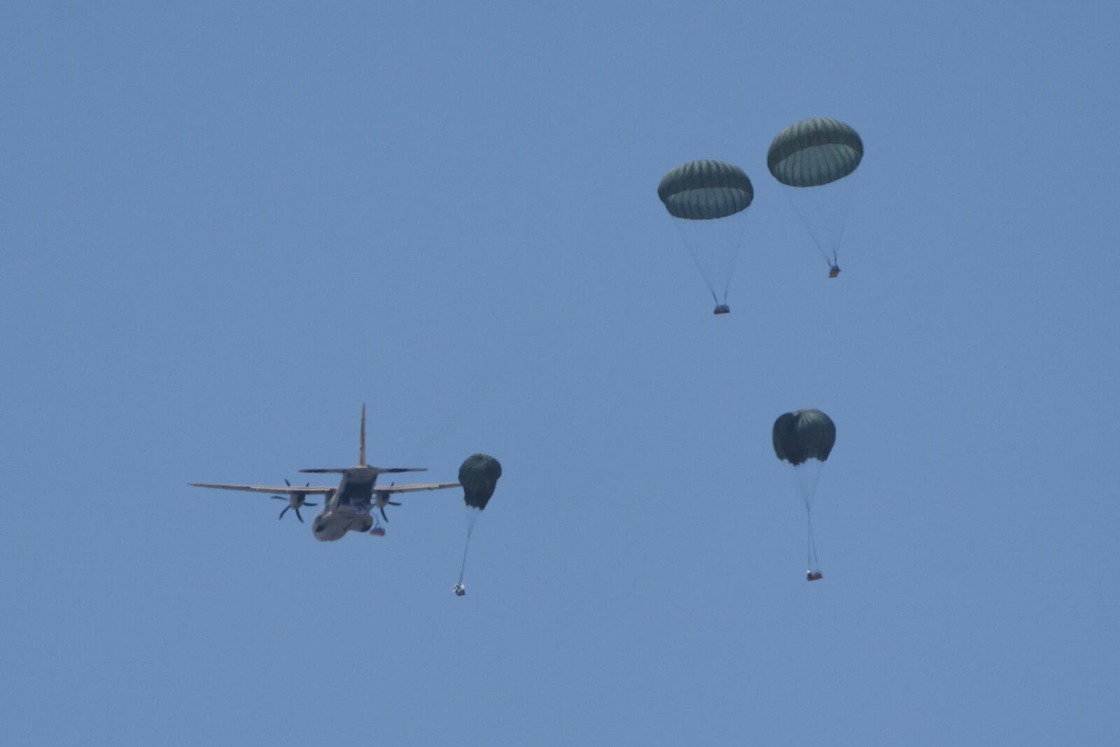 Humanitarian aid is airdropped to Palestinians over Deir al-Balah, central Gaza Strip Wednesday, July 30, 2025. (AP Photo/Abdel Kareem Hana)