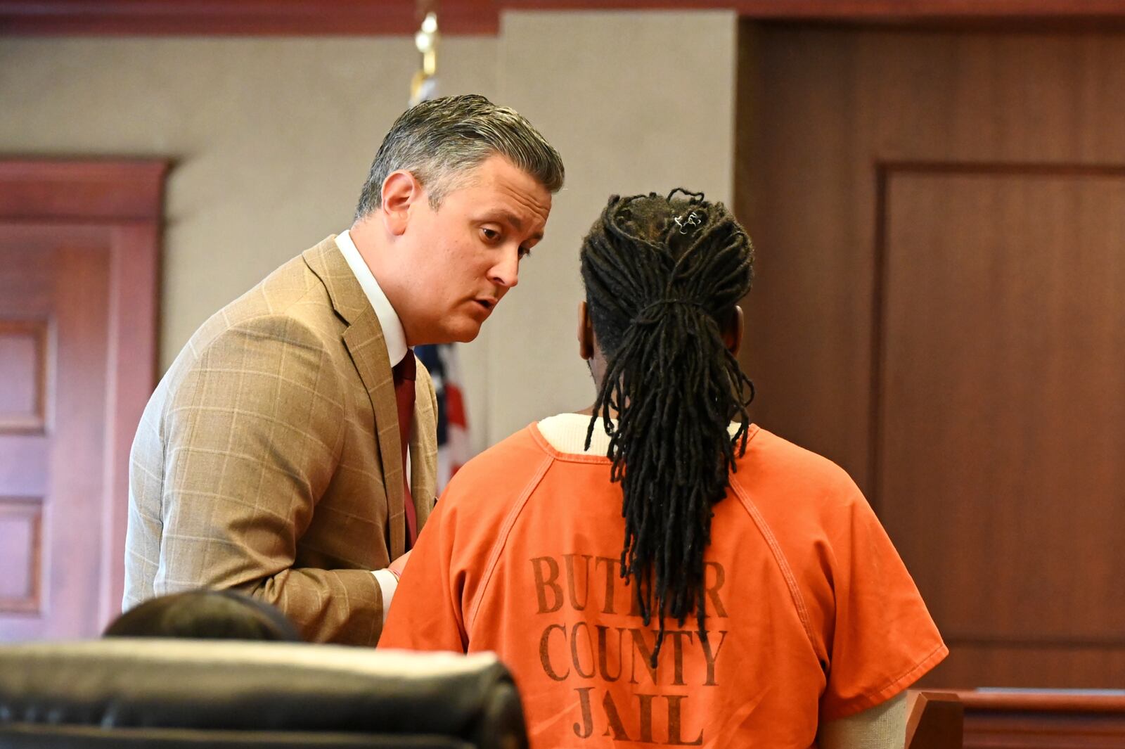 Defense attorney Arthur Southard confirs with his client, Anthony Folkes, 32, of Fairfield, during a hearing on April 8, 2025. Folkes is charged with assault, strangulation and resisting arrest. He was stopped by a Hamilton police officer in January 2025 for having a headlight out, but a confrontation escalated. He pled not guilty during his arraignment last month. MICHAEL D. PITMAN/STAFF