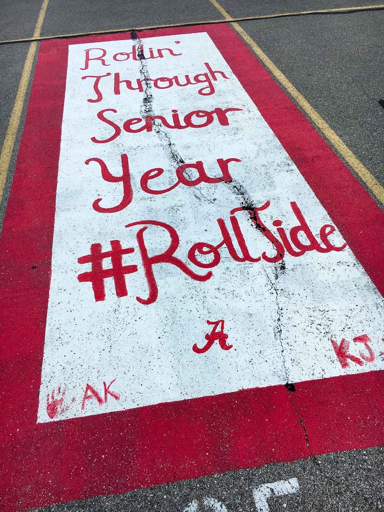 PHOTOS Lakota East seniors paint parking spots
