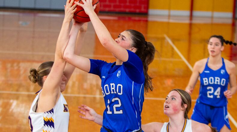 Springboro's Bryn Martin is fouled by Butler during the first half of Saturday's Division I tournament game Saturday at Troy High School. Jeff Gilbert/CONTRIBUTED