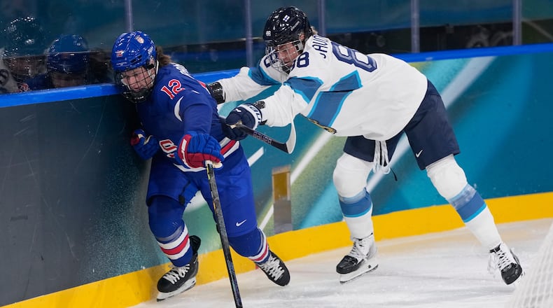 Finland's Ronja Savolainen, right, challenges United States' Kelly Pannek during a preliminary round match of women's ice hockey between the United States and Finland at the 2026 Winter Olympics, in Milan, Italy, Saturday, Feb. 7, 2026. (AP Photo/Petr David Josek)