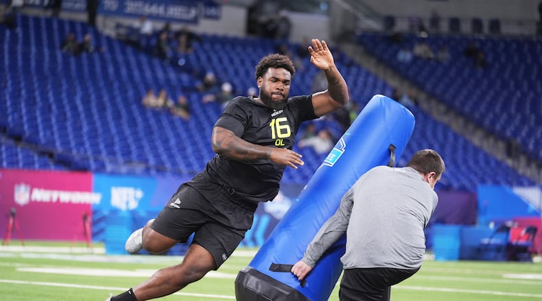 Oregon defensive lineman Derrick Harmon runs a drill at the NFL football scouting combine in Indianapolis, Thursday, Feb. 27, 2025. (AP Photo/Michael Conroy)