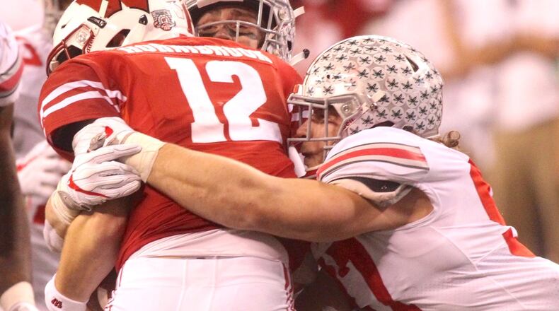Ohio State’s Nick Bosa tackles Wisconsin’s Alex Hornibrook on Dec. 2, 2017, at Lucas Oil Stadium in Indianapolis. David Jablonski/Staff