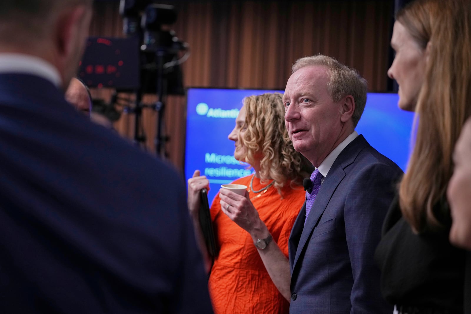 Microsoft's President Brad Smith, center, arrives for a conference on digital resilience during geopolitical volatility in Brussels, Wednesday, April 30, 2025. (AP Photo/Virginia Mayo)