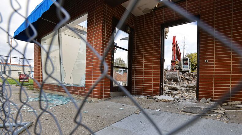 Demolition is happening this week to make progress toward the Rossville Flats complex in Hamilton. It will include about 75 to 80 apartments in the 300 block of Main Street. Frost Factory, which has been a hit at Liberty Center with real-fruit slushies for adults and kids, including alcohol for the adults, signed a lease to open a second location next year on the street level of the complex. Officials say it is the first new construction of apartments in the commercial stretch of Main Street near the Great Miami River in about a century. NICK GRAHAM / STAFF