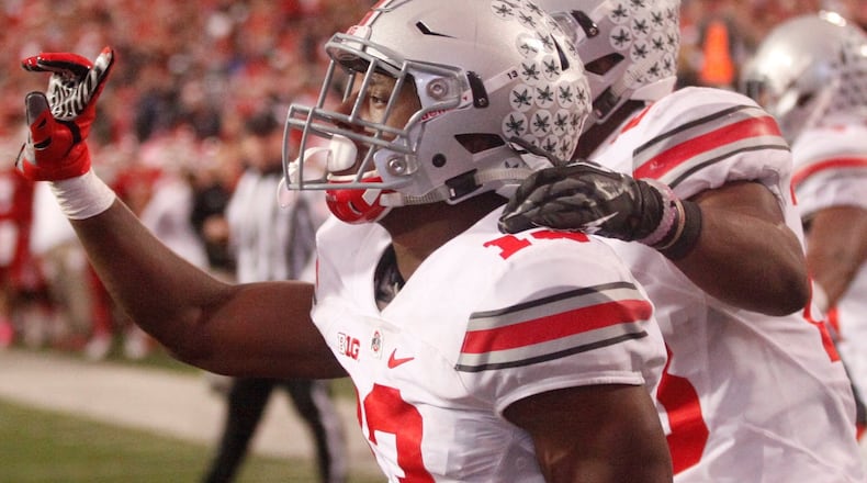 Ohio State’s Eli Apple celebrates after breaking up the final pass of the game in the end zone against Indiana on Saturday, Oct. 3, 2015, at Memorial Stadium in Bloomington, Ind. David Jablonski/Staff