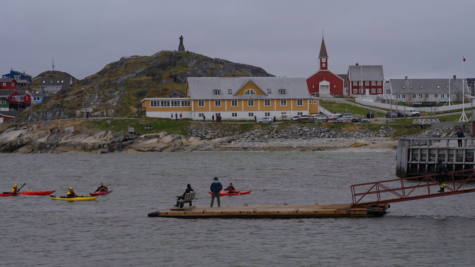 Tourists kayak at sea in front of Nuuk Cathedral in Nuuk, Greenland, Monday, June 16, 2025. (AP Photo/Kwiyeon Ha)
