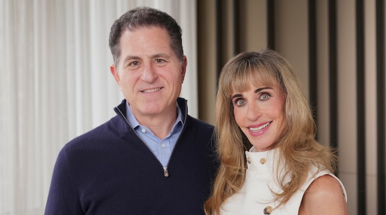 Michael and Susan Dell pose for photographs Nov. 26, 2025, in New York. (AP Photo/Frank Franklin II)