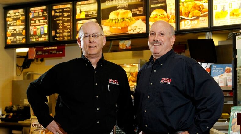 Ken Riddle (left) and Chuck Doran are the co-founders of Far Hills Development LLC and operate over a dozen Lee’s Famous Recipe restaurants. LISA POWELL/STAFF